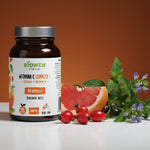  Witamina C Complex+ Biowen z grejpfrutem, owocami róży i ziołami na białym tle.