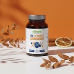 Cynk Complex Biowen wspierającego odporność, ustawiona na jasnym tle z liśćmi i plasterkiem cytryny.