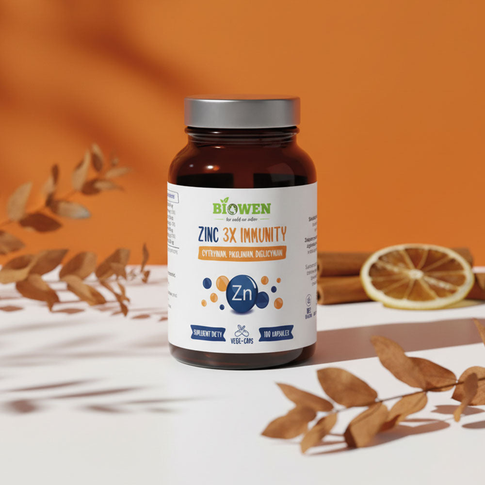 Cynk Complex Biowen wspierającego odporność, ustawiona na jasnym tle z liśćmi i plasterkiem cytryny.