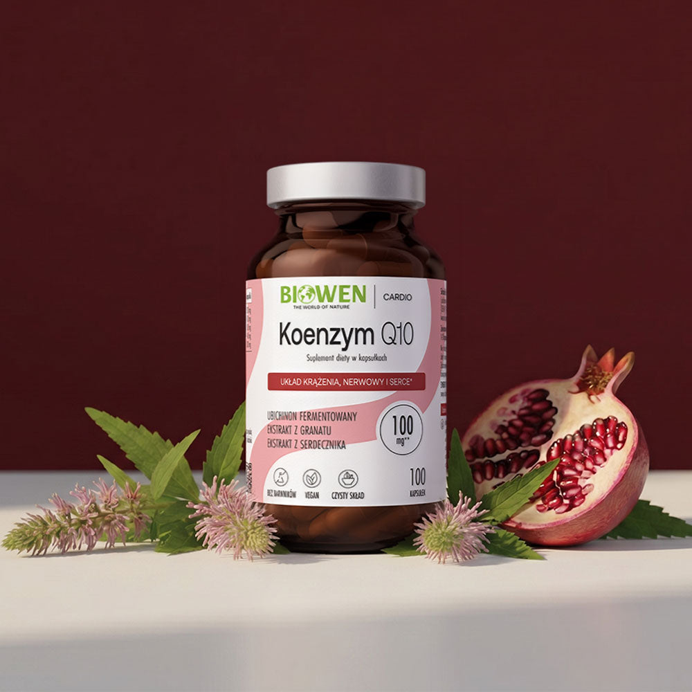 Koenzym Q10 Biowen w kapsułkach z granatem i roślinami na bordowym tle