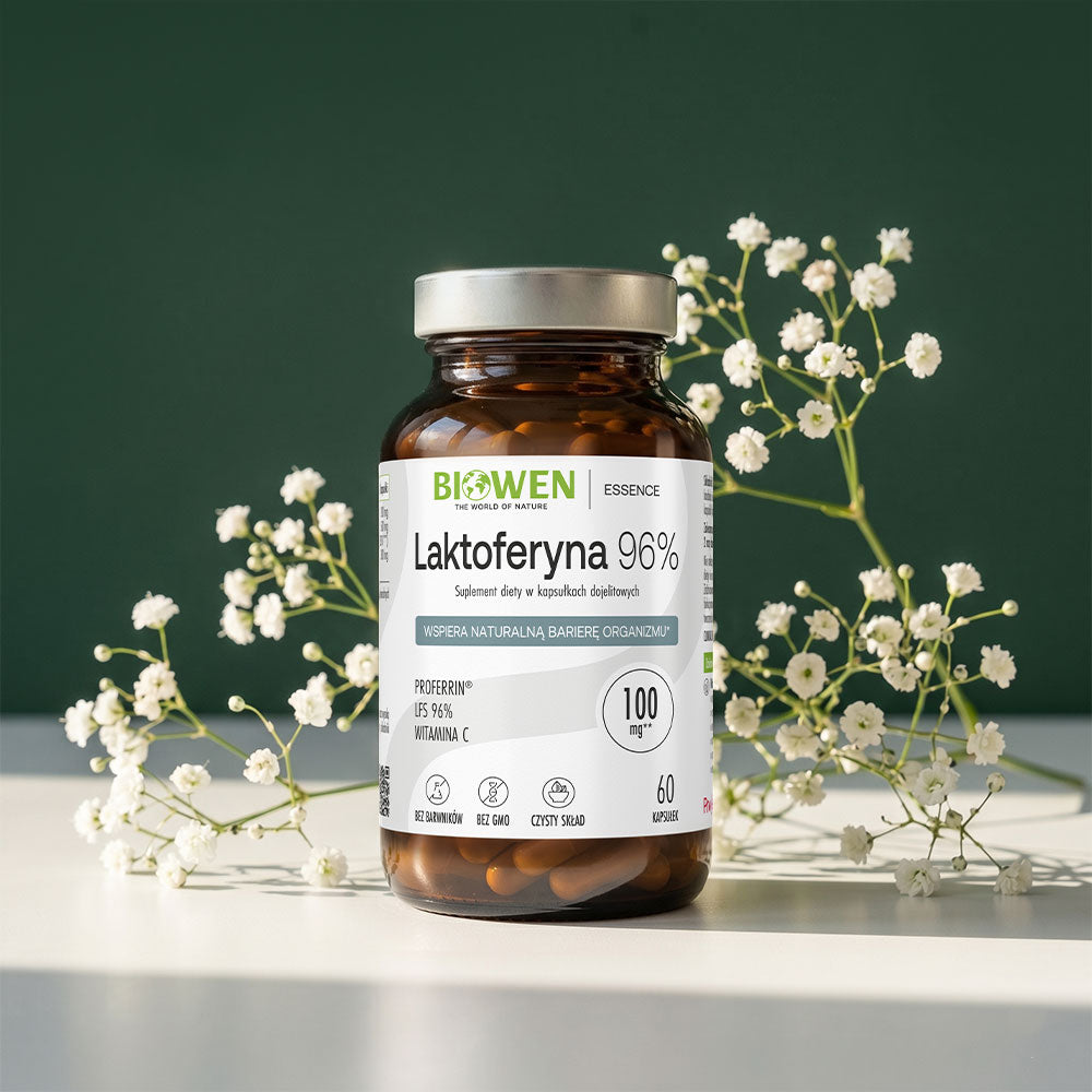 Laktoferyna 96% Biowen Essence – suplement diety w kapsułkach dojelitowych, 100 mg Proferrin LFS, z witaminą C, 60 kapsułek, bez barwników, bez GMO, czysty skład, na tle białych kwiatów