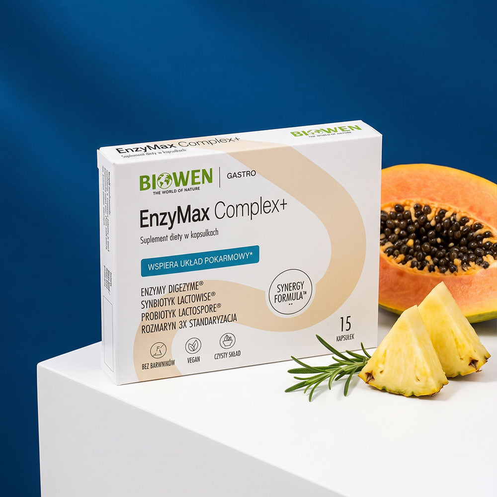 EnzyMax Complex+ Biowen obok papai, kawałków ananasa i gałązki rozmarynu.