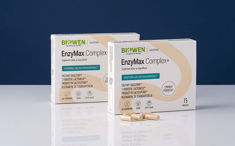 Dwa opakowania EnzyMax Complex+ Biowen z kapsułkami na białym blacie.