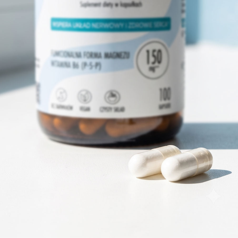 Dwie kapsułki Biowen Taurynian Magnezu 150 mg z witaminą B6 przed opakowaniem produktu.